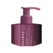 Purple Davroe hair treatment bottle with pump on a white background