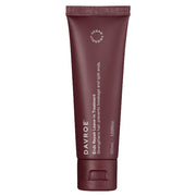 Brown tube of Dávrée hair treatment on a white background