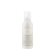 White bottle of Awapuhi by Millipore hair product on a white background