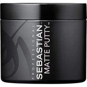 Black container of Sebastian Matte Putty with branding on a black background