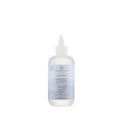Bottle of Awapuhi hair product on a white background