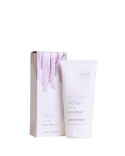 White hair care product with packaging on a white background