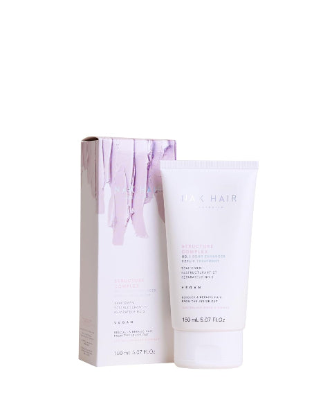 White hair care product with packaging on a white background