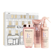 Kérastase hair care products including bottles and a box on a white background