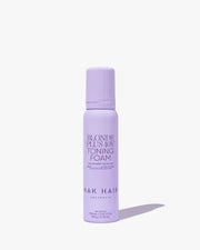 Purple bottle of NAK HAIR Blonde Plus Joy Toning Foam on a white background