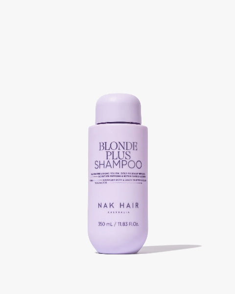 Purple shampoo bottle labeled 'Blonde Plus Shampoo' by NAK Hair on a white background