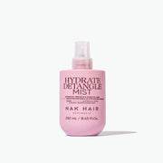 Pink bottle of NAK Hair Hydrate Detangle Mist on a white background