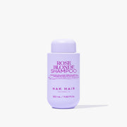 Purple shampoo bottle labeled 'Rose Blonde Shampoo' by NAK Hair on a white background