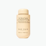 Nak Hair Volume Condition bottle on a white background