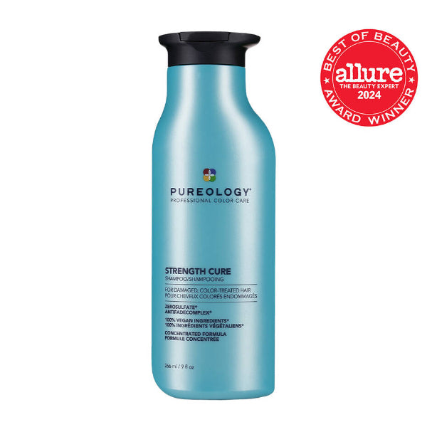 Blue shampoo bottle with black cap and Pureology branding, featuring Allure Best of Beauty Award 2024 badge on a white background.