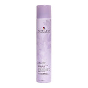 Purple bottle of Pureology Lock It Down Hairspray on a white background