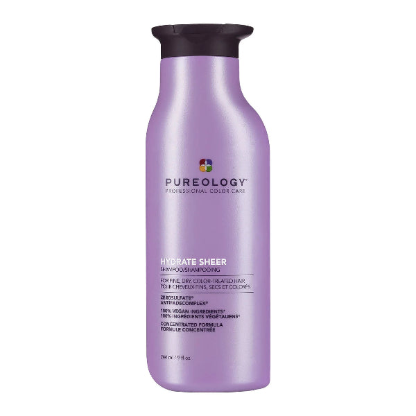 Purple shampoo bottle with black cap on a white background
