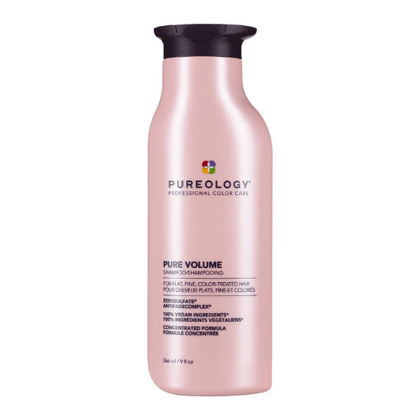 Pink shampoo bottle with black cap on a white background