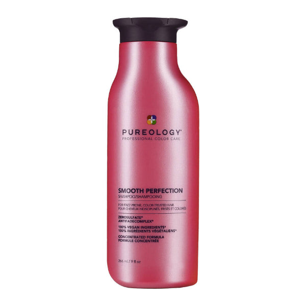 Pink shampoo bottle with black cap labeled 'Pureology Smooth Perfection' on a white background
