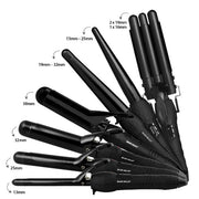 Set of black hair styling wands with size labels on a white background