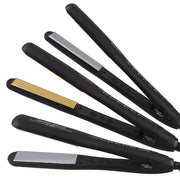 Set of black hair straighteners with gold and silver accents on a white background