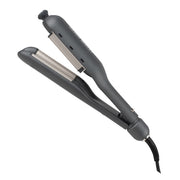 Black hair straightener on a white background