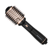Black and rose gold hairbrush with 'Silver Bullet' branding on a white background