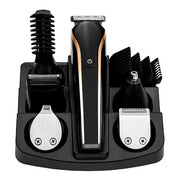Set of grooming tools including a hair trimmer, beard trimmer, and attachments on a white background