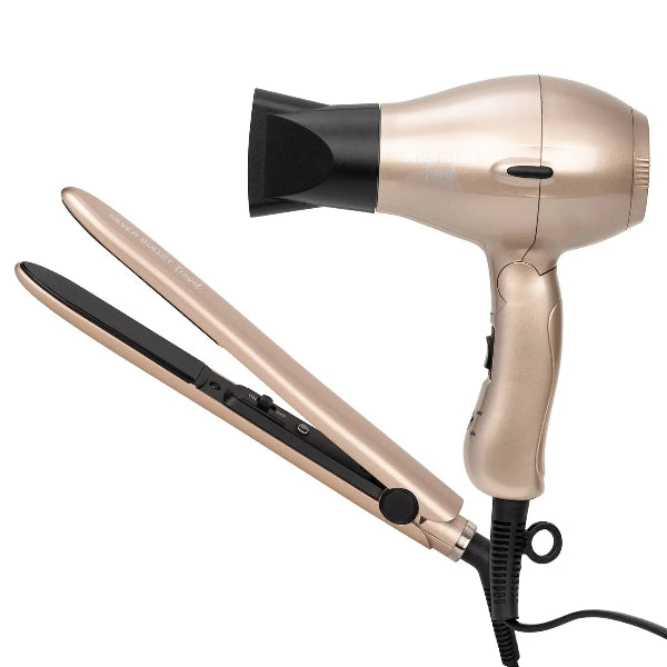 Rose gold hair dryer and flat iron on a white background