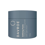Blue jar of Davroe Defining Paste on a white background