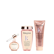 Kérastase hair care products including a serum, shampoo, and conditioner on a white background