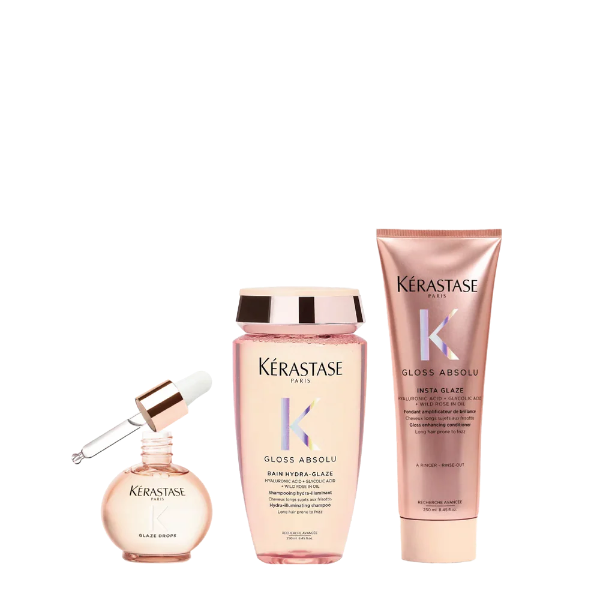 Kérastase hair care products including a serum, shampoo, and conditioner on a white background
