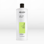 Nioxin shampoo bottle on a white background